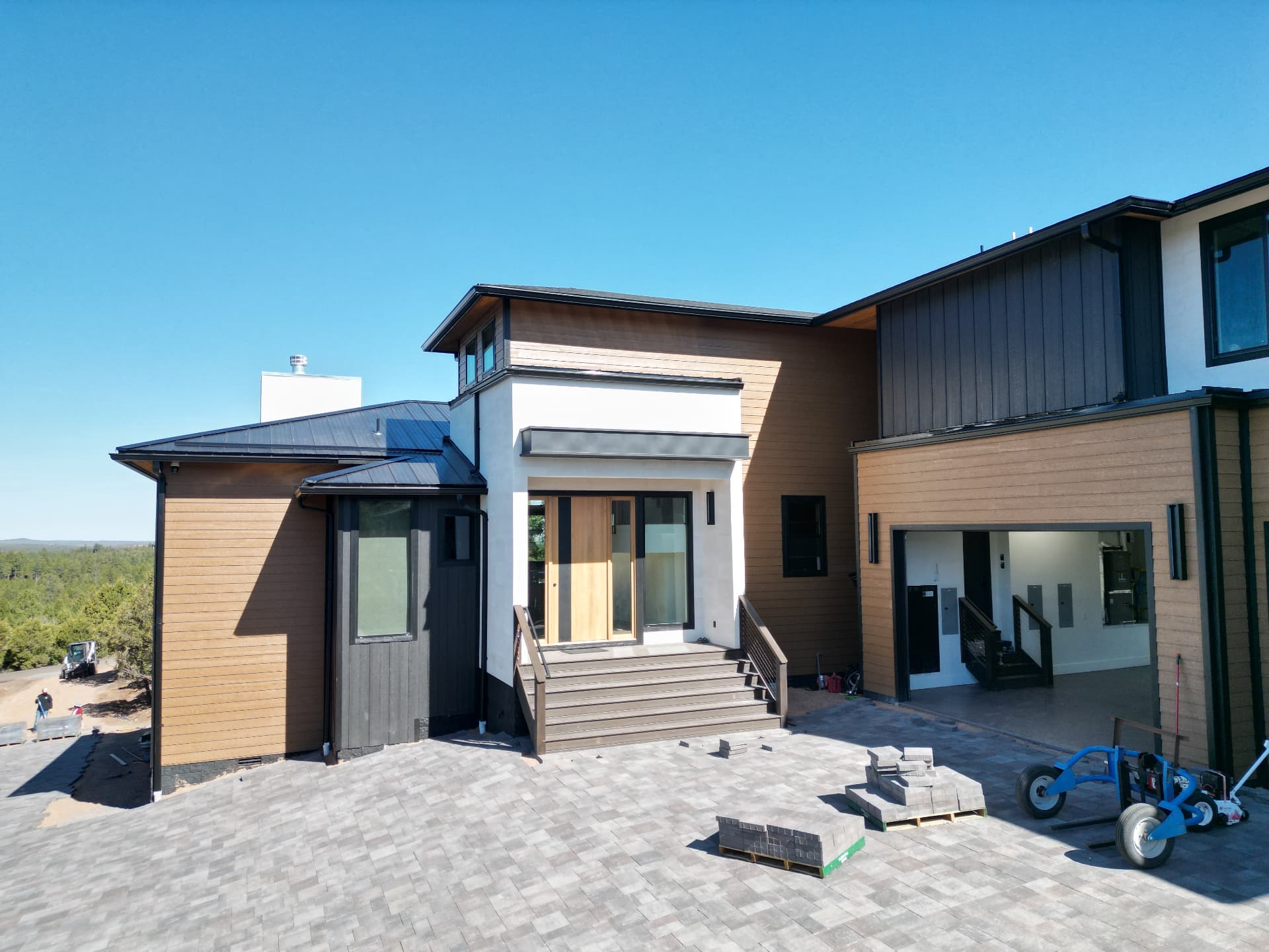 Mountain residence — entry elevation and paver courtyard