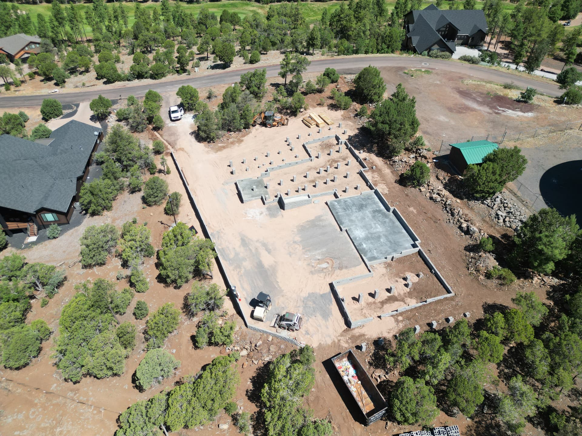 Mountain residence — slab poured and site backfilled aerial