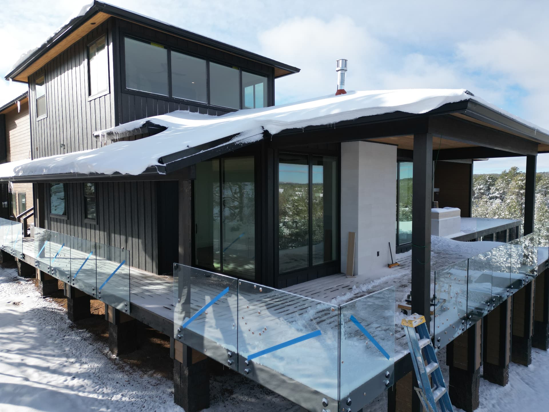 Mountain residence — covered deck and glass railing